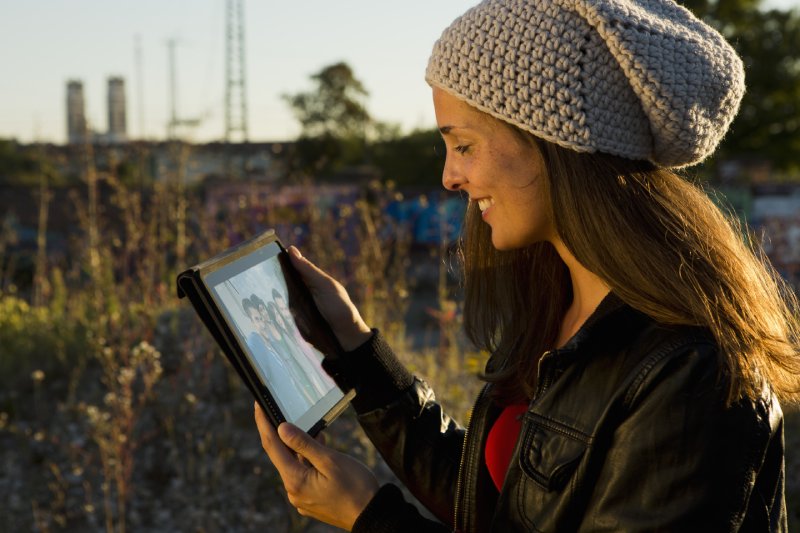 young-woman-looking-at-digital-tablet-screen-2024-06-04-19-14-36-utc